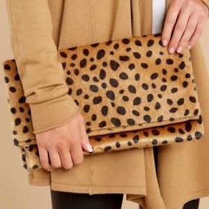 Brand new Animal print clutch.
